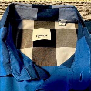 Burberry London.  Never worn.  Dry cleaned once.